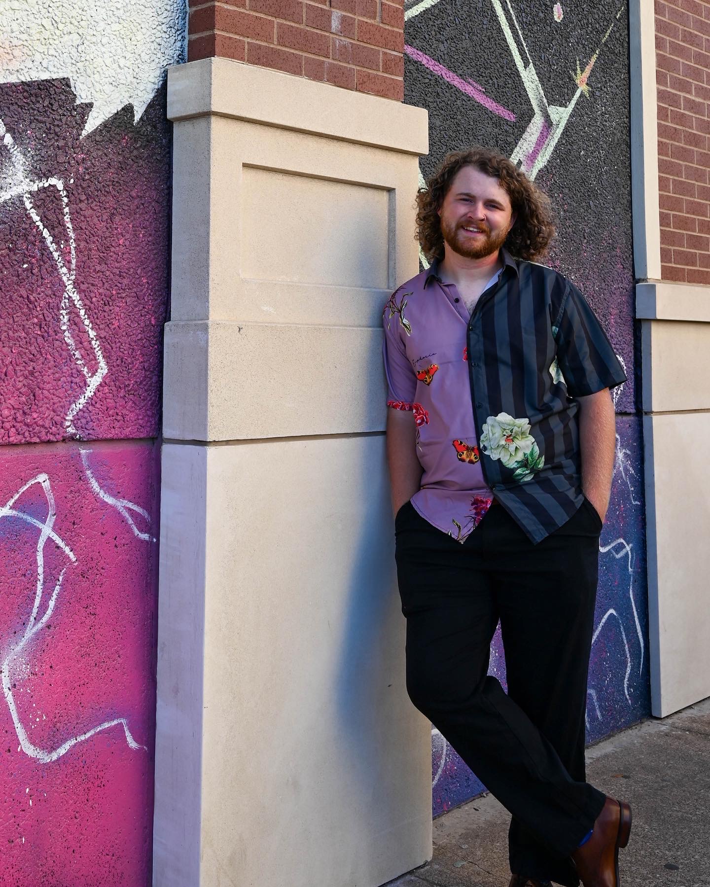 Bret leaning against a wall.